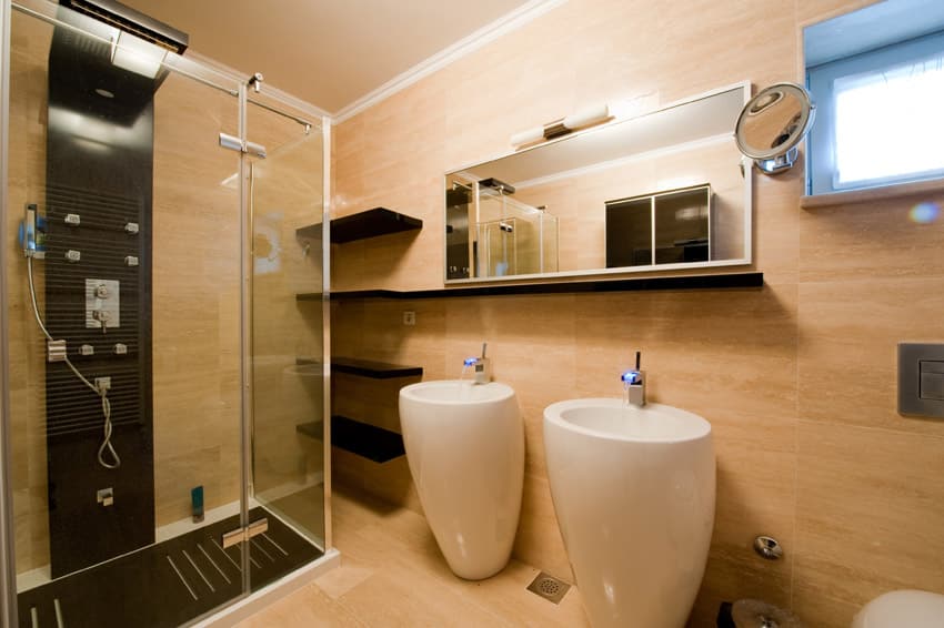 Interesting vessel sinks in bathroom with glass shower