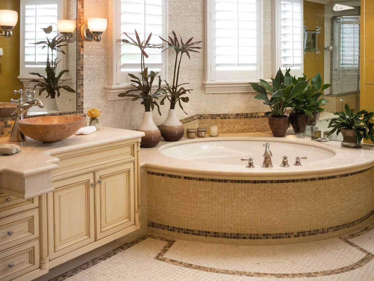 Elegant luxury bathroom with off-white cabinet and golden and tan tile