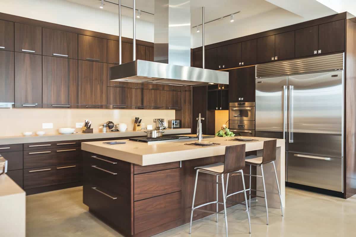 Brown modern kitchen with stainless oven hood
