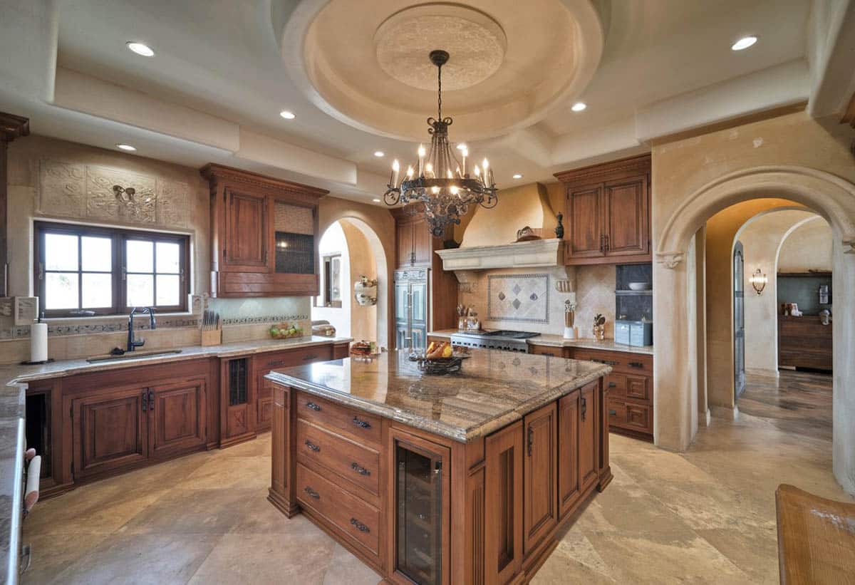 Kitchen with rustic iron chandelier and large island