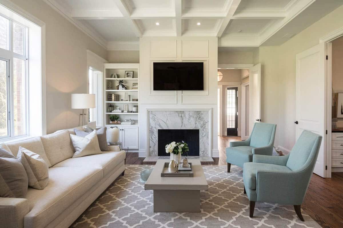 Cozy room with carrara marble fireplace and wood plank floors