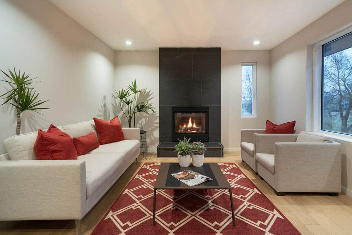 Cozy room with gas fireplace and wood stained floors