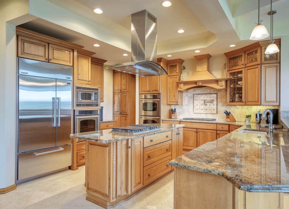 High end kitchen with granite and light wood cupboards