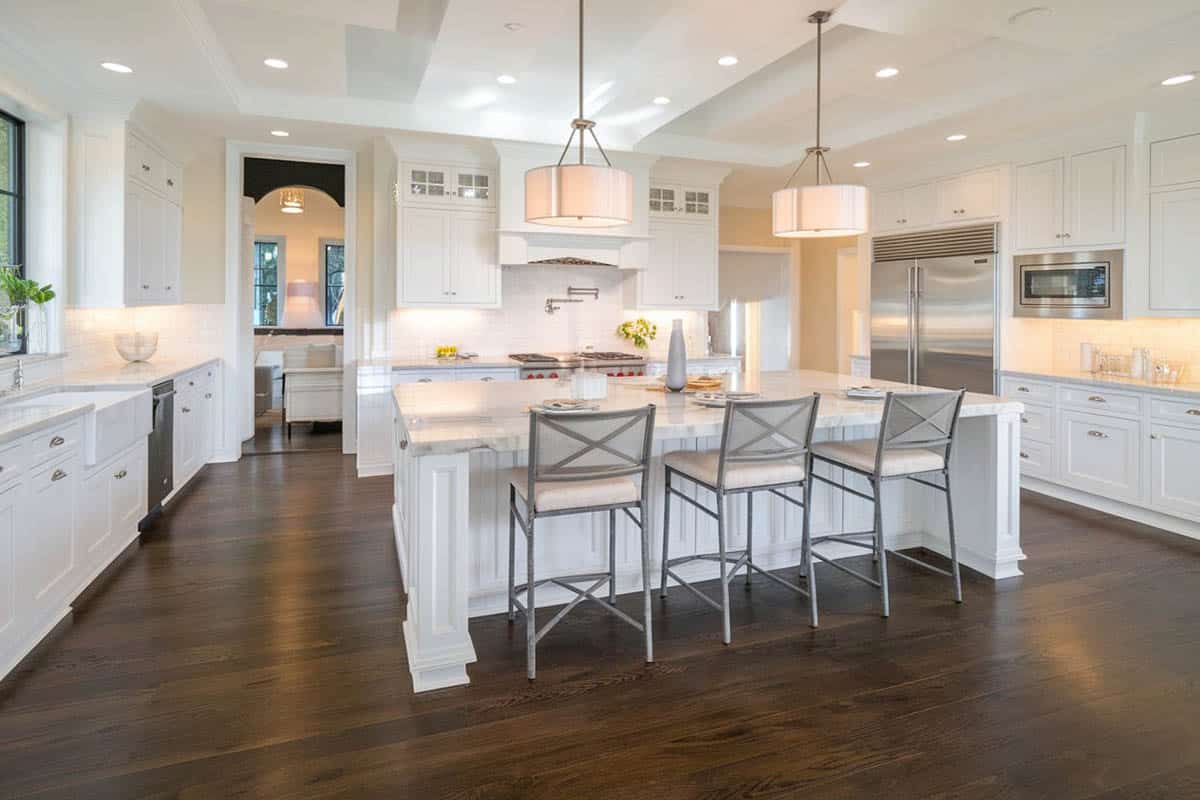 cabinets with round knobs, chrome faucets, flush lights and light cream ceiling