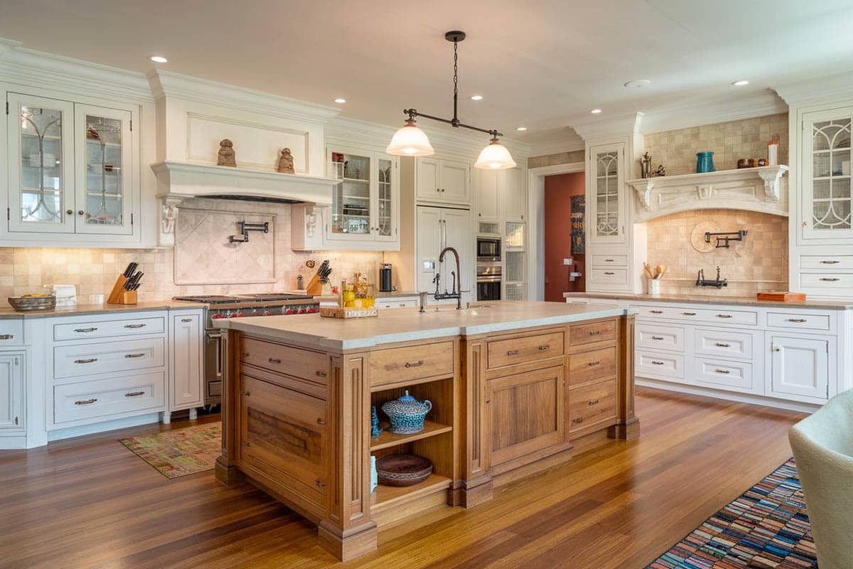 Kitchen with big doors, sky blue colored walls with neo classical inspired cabinets