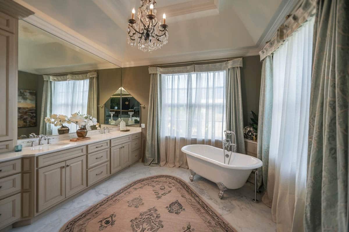 Bathroom with cast iron clawfoot tub and carrara marble counter