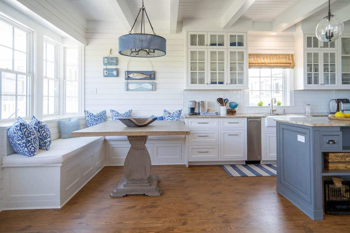Kitchen with marine blue island, granite countertops and window seat bench