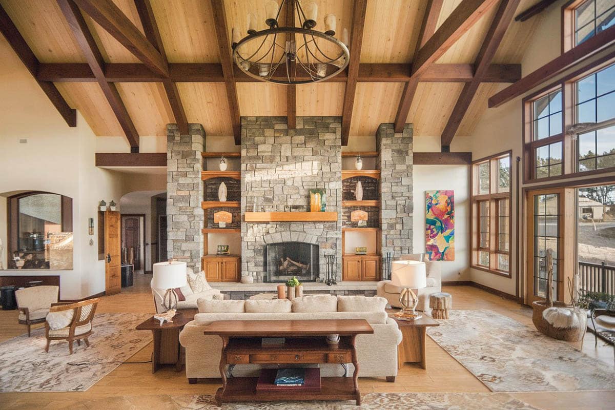 Spacious room with large window view and vaulted ceiling