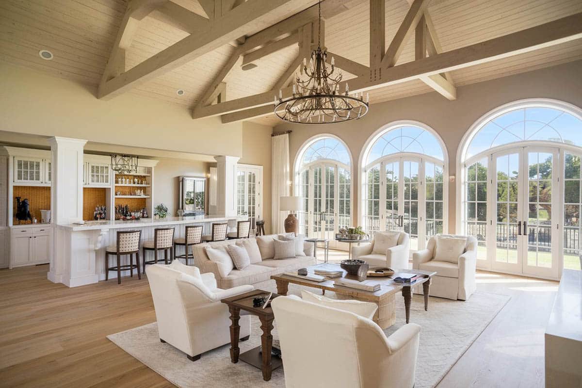 Room with cathedral ceiling, limestone floors and home bar