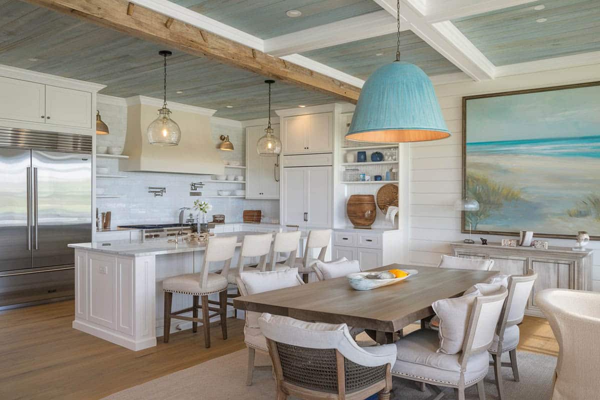 White cabinet kitchen with weathered wood ceiling, flooring and dining island