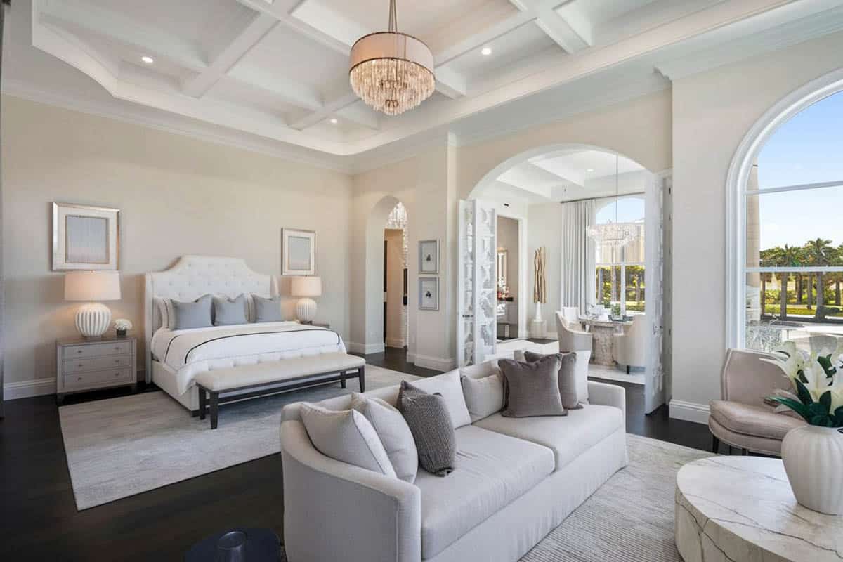 White fabric bed, sofa seat and chandelier
