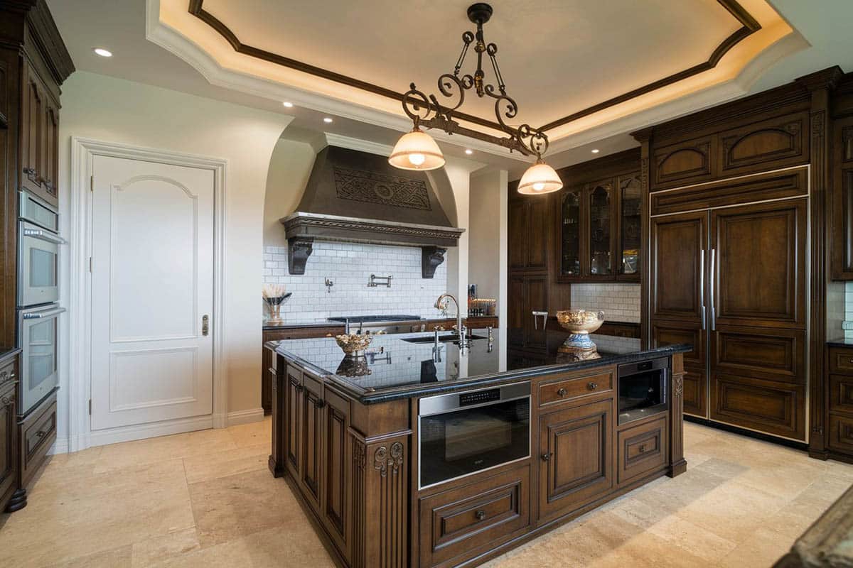 6 burner range, black granite counter and white subway tile