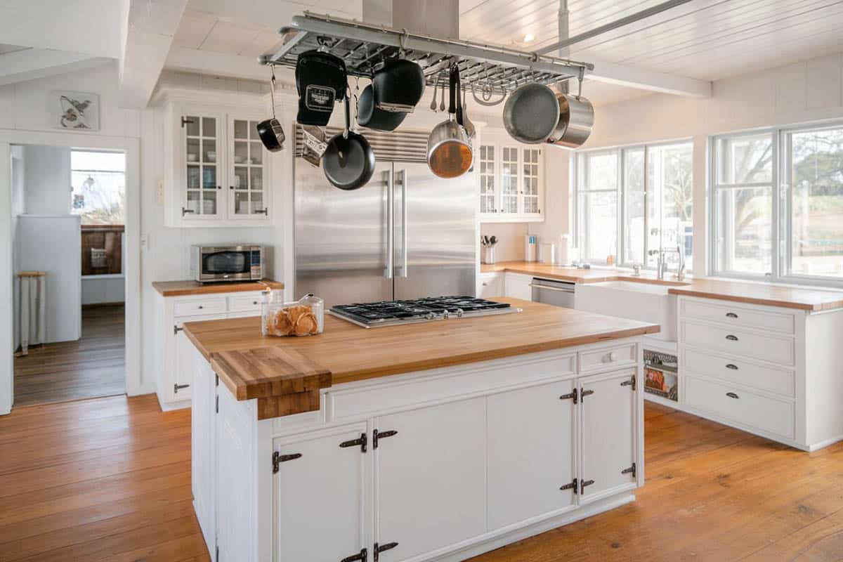 Kitchen with glass panel cabinets, and maple wood countertops