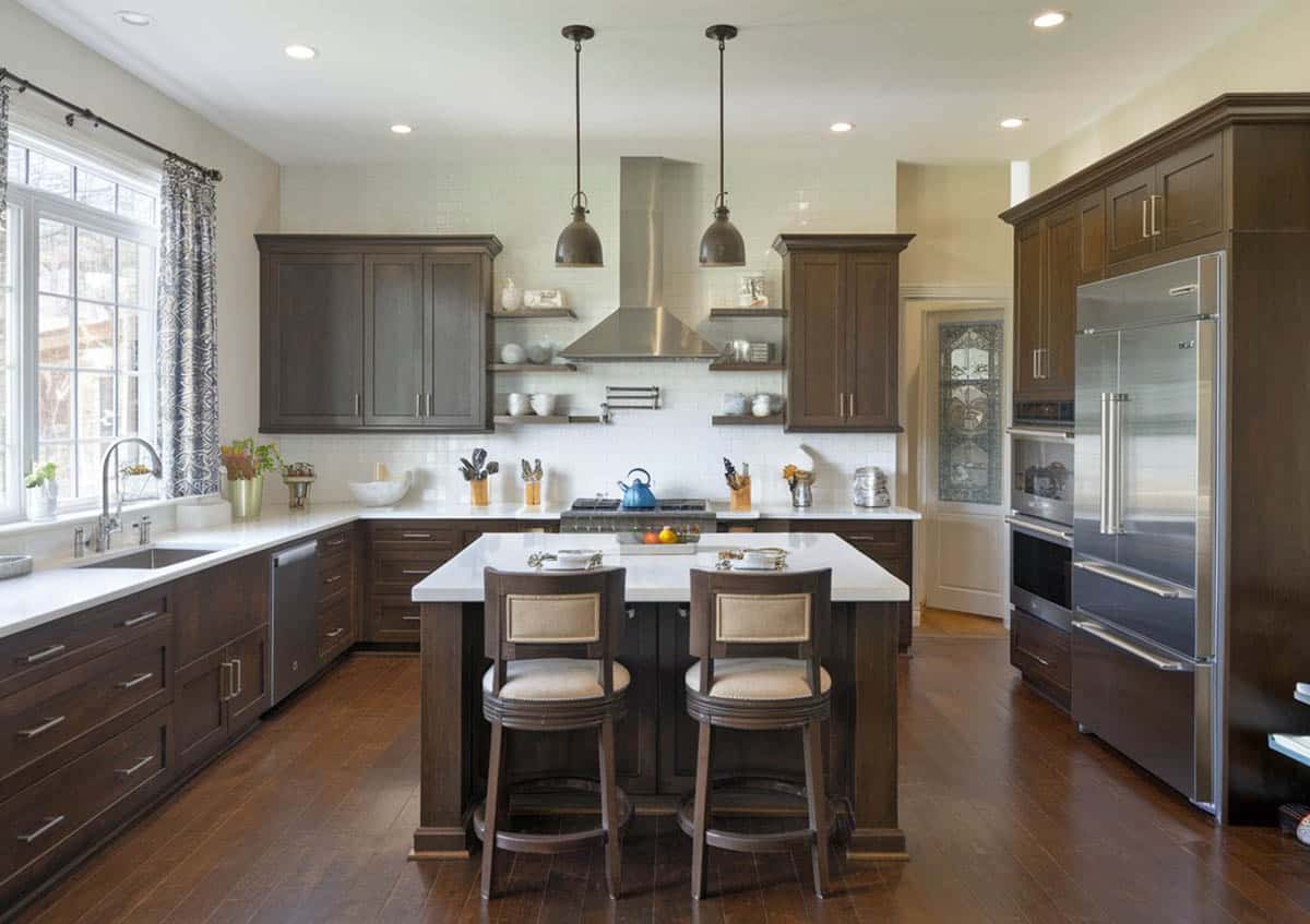U shaped kitchen design, white countertops and dark finish kitchen cabinets