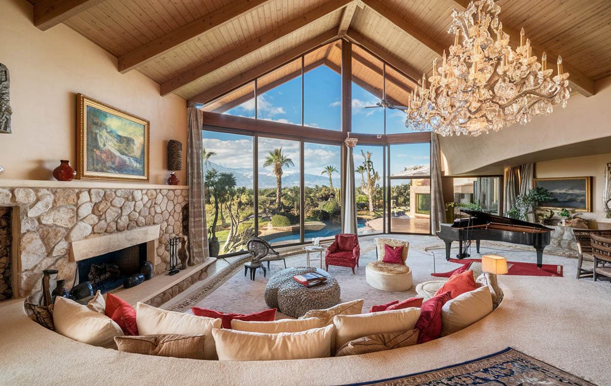 Room with large chandelier, skylight and vaulted ceiling