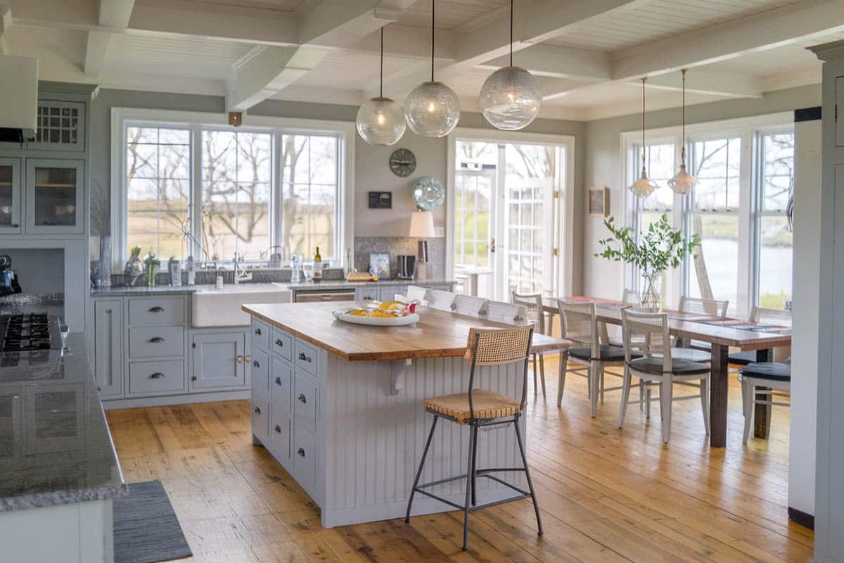 Kitchen with island, wood flooring, and farmhouse sink