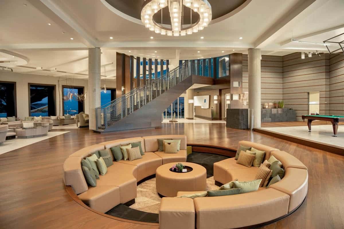 Sunken living room with wood flooring and high ceilings