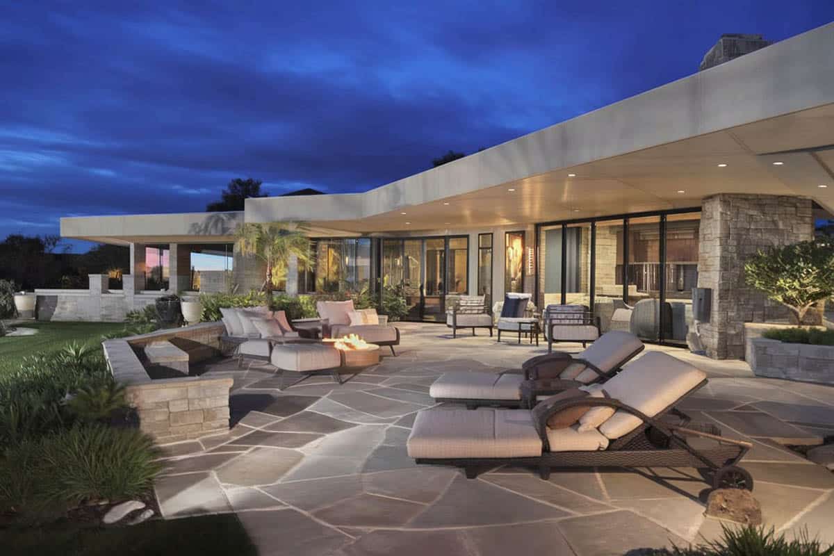 Contemporary flagstone patio in the backyard on a luxury home