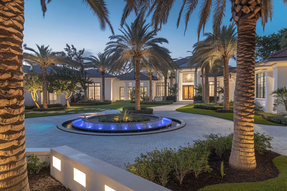 Modern luxury brick circular driveway around water feature