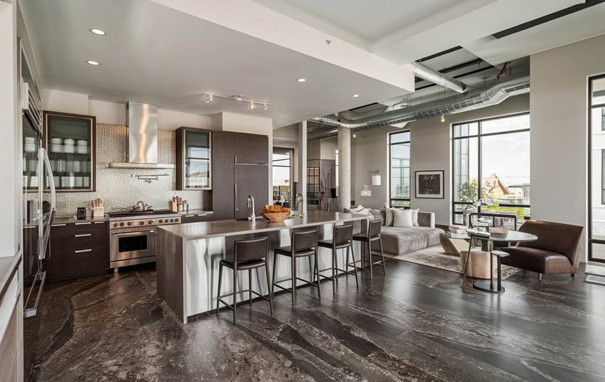 Industrial style room with stainless front island and color concrete floor