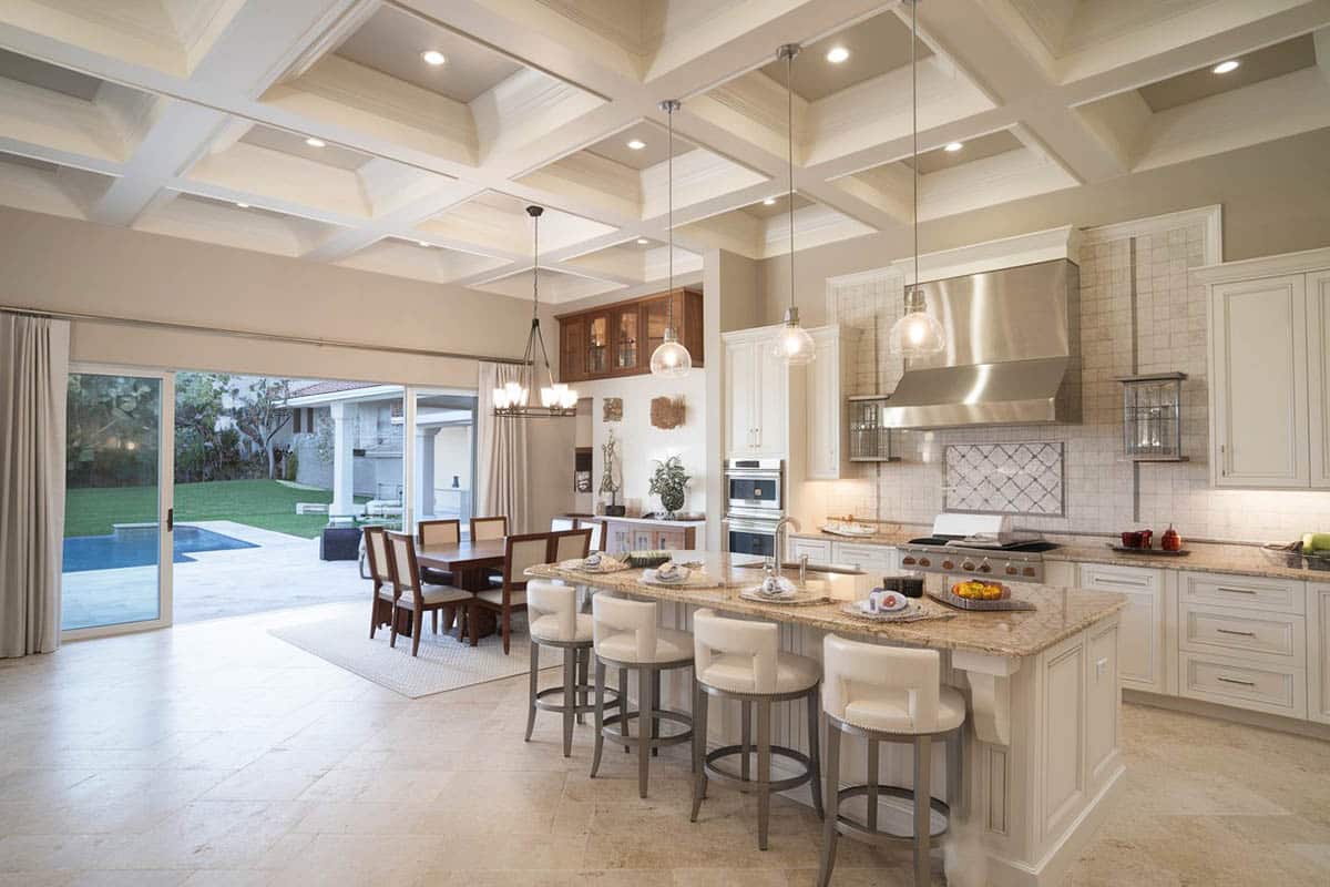 Kitchen with large eat-in island and swimming pool view