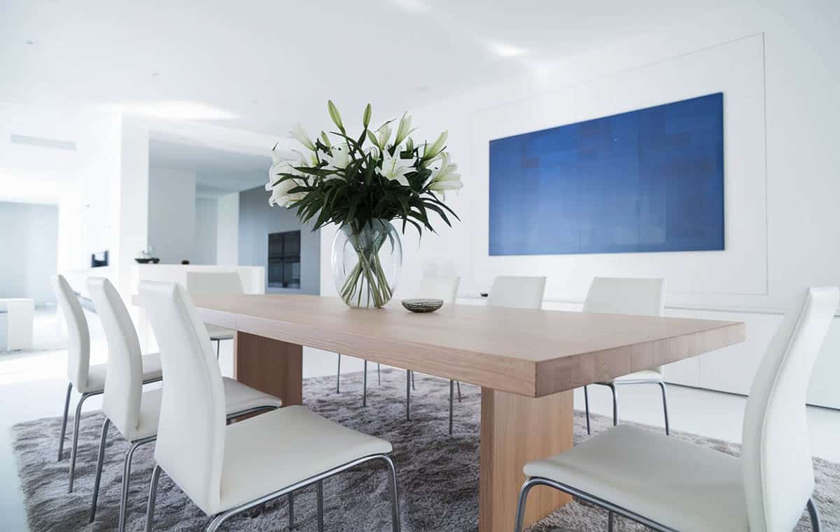 Dining room with reclaimed wood table and silver chairs
