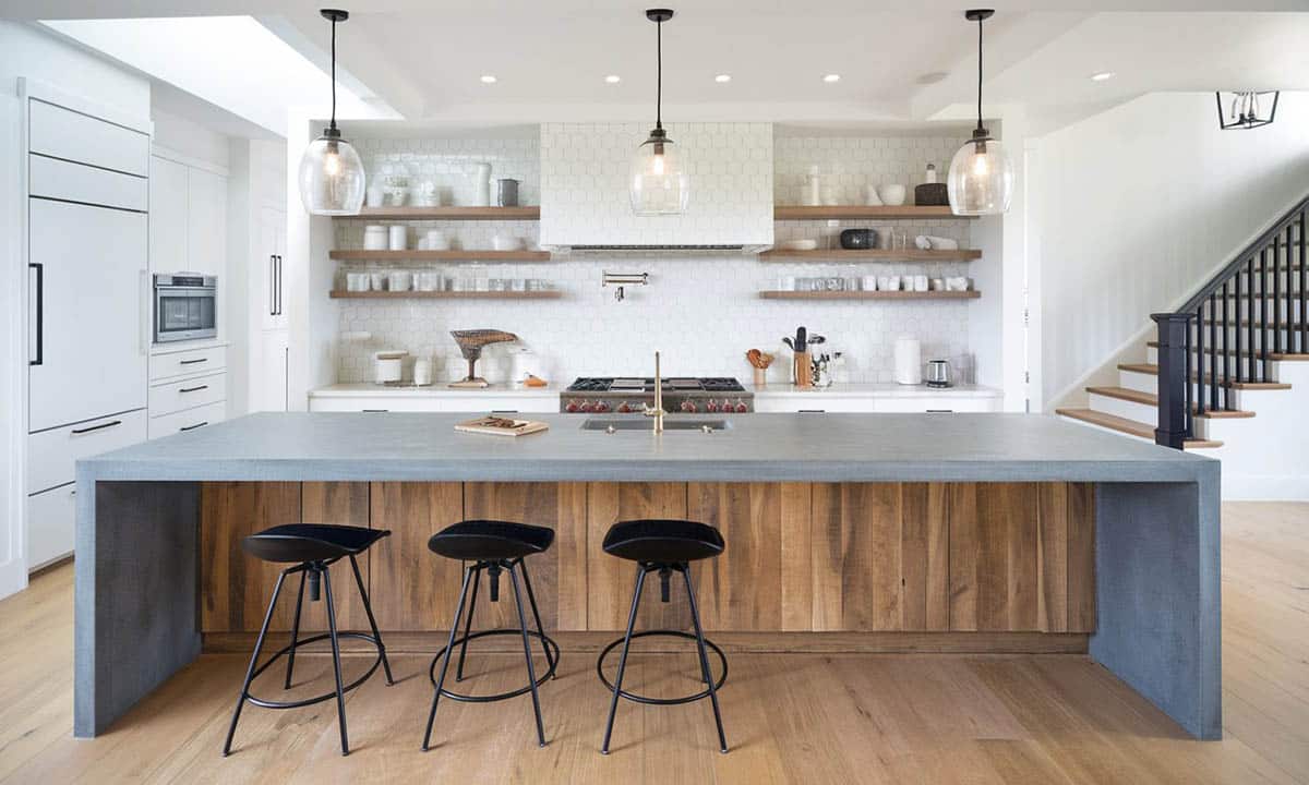 Kitchen with walnut wood island, metal stools and quartz countertops
