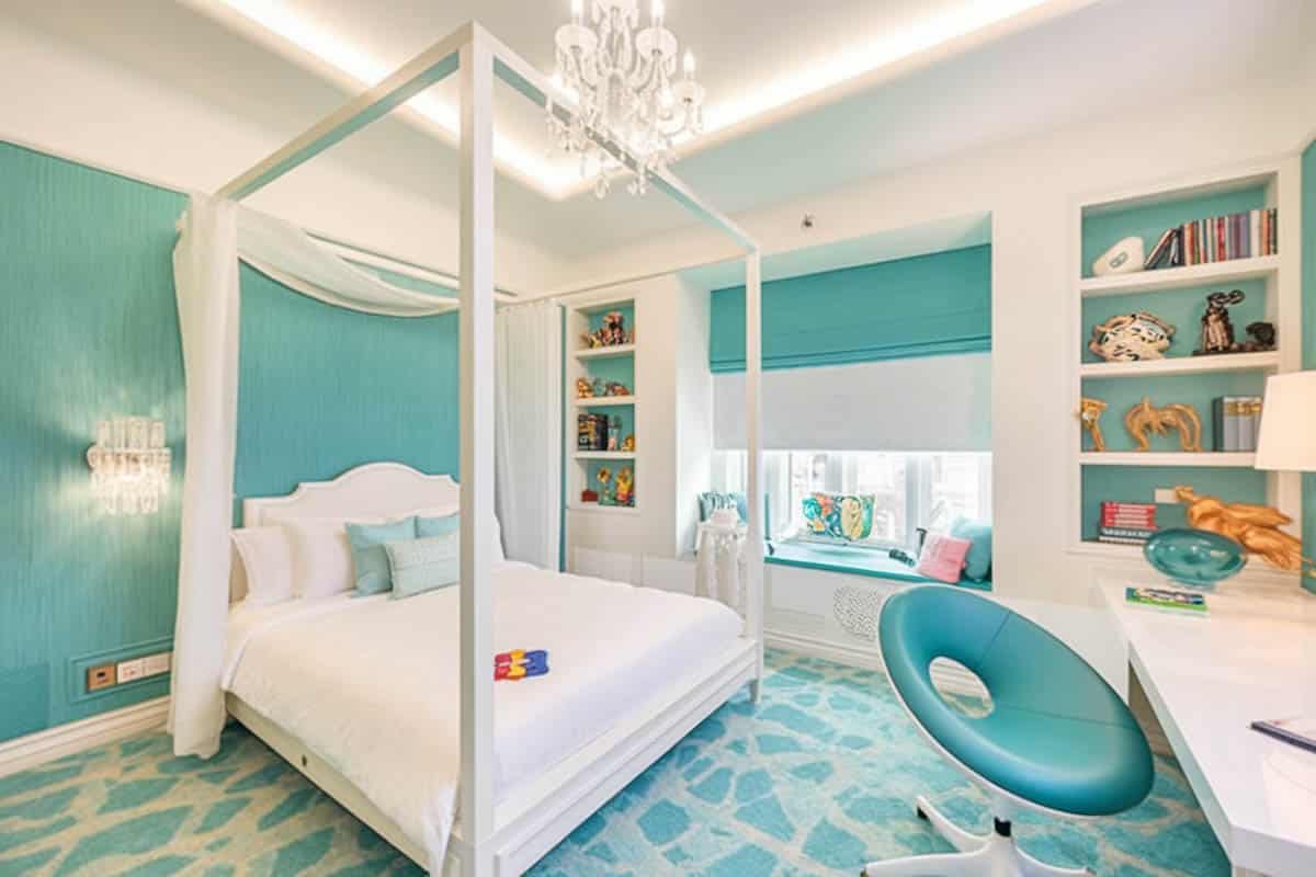 Contemporary room with fabric walls, modern high post bed and teal shades
