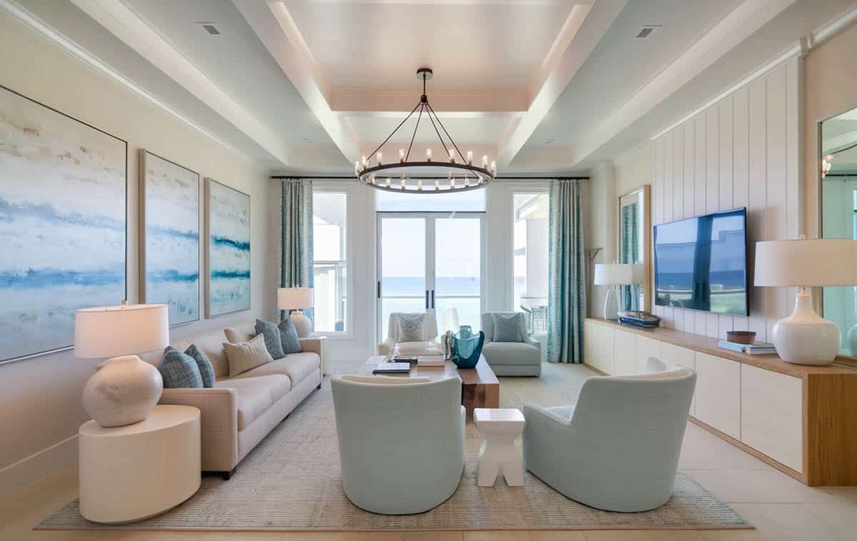Ocean view living room with contemporary design and circular chandelier
