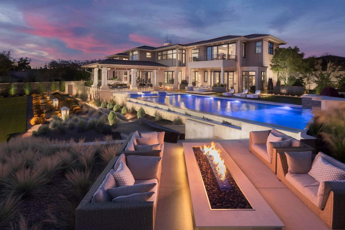 Fire pit patio with rectangular design next to a rectangular pool