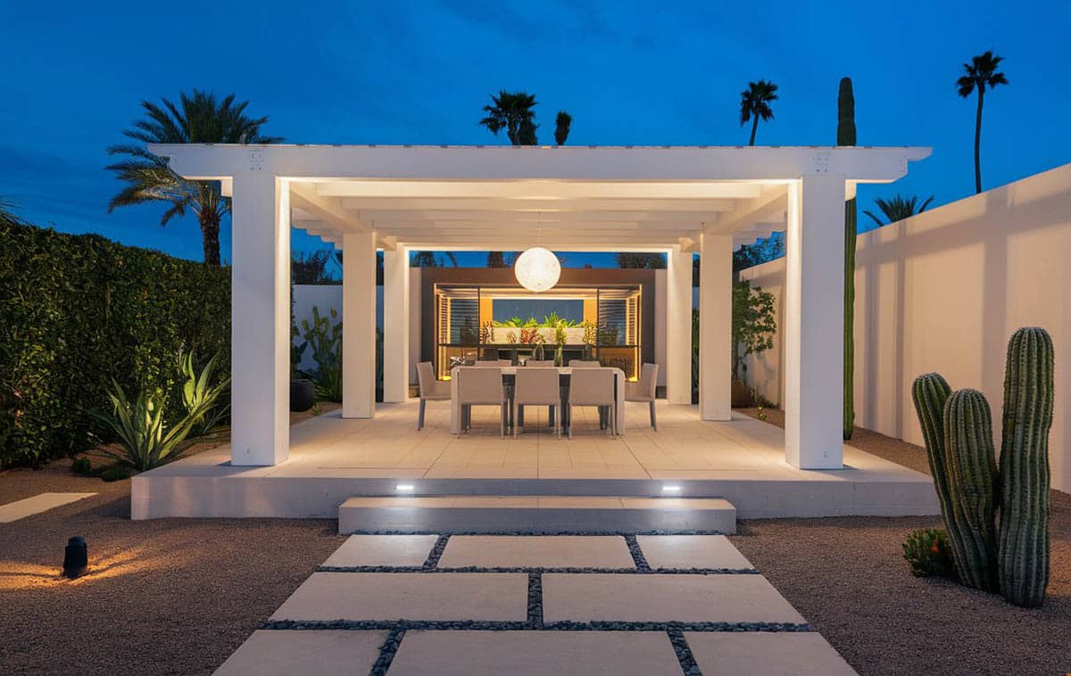 Pavilion in backyard with porcelain tile pathway, recessed lighting and hanging globe decoration