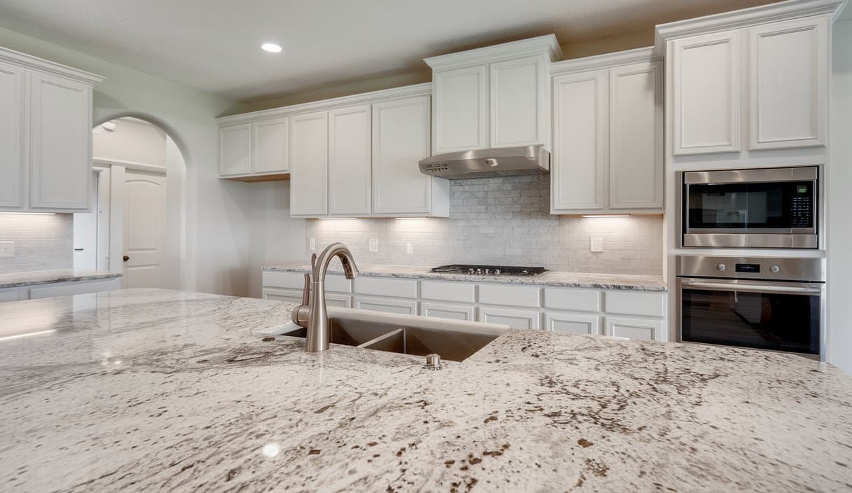 Traditional kitchen with white panel cabinets
