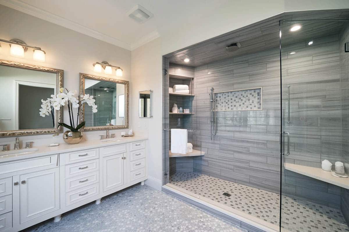Large shower with glazed tile and bench
