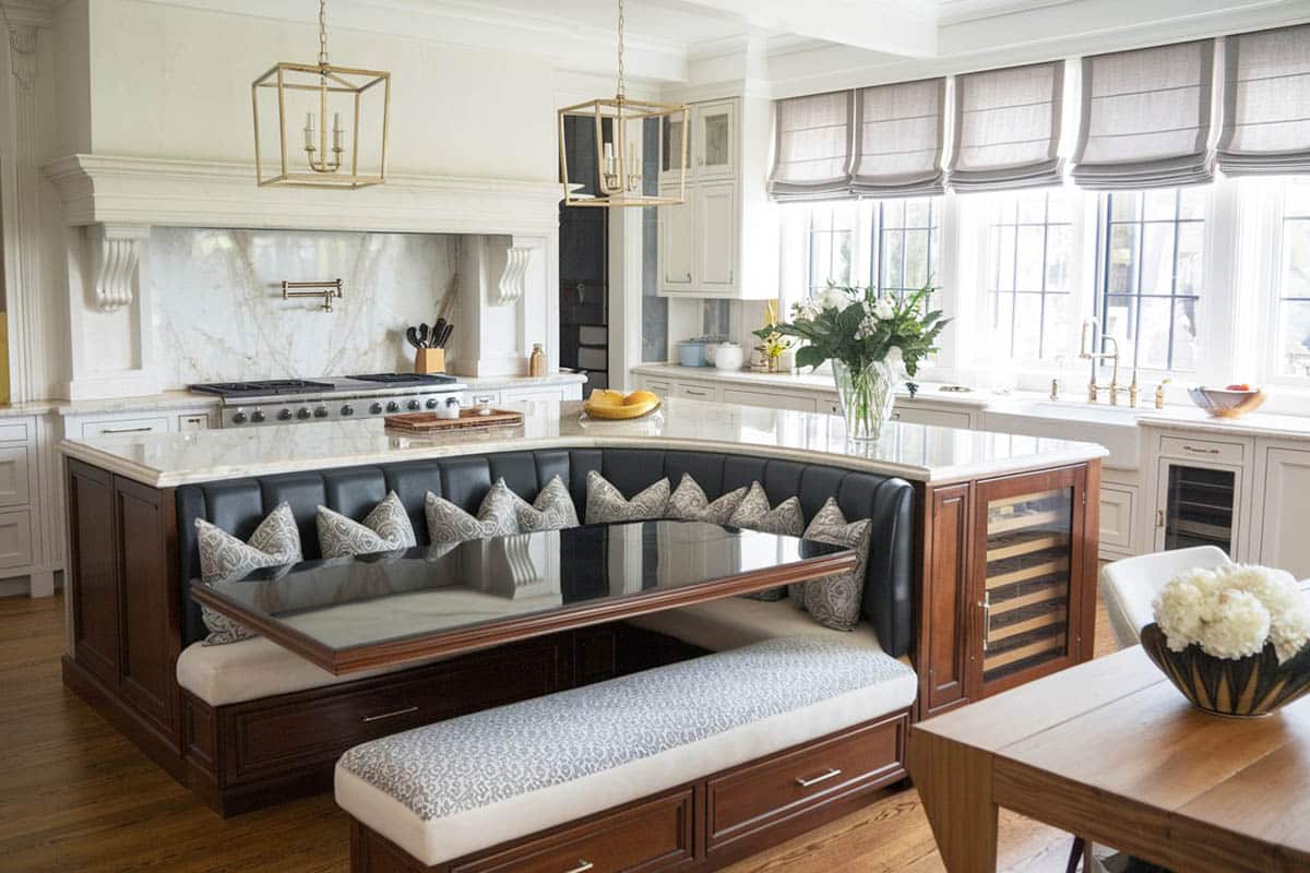 Luxury marble kitchen with l shaped island with built in leather bench