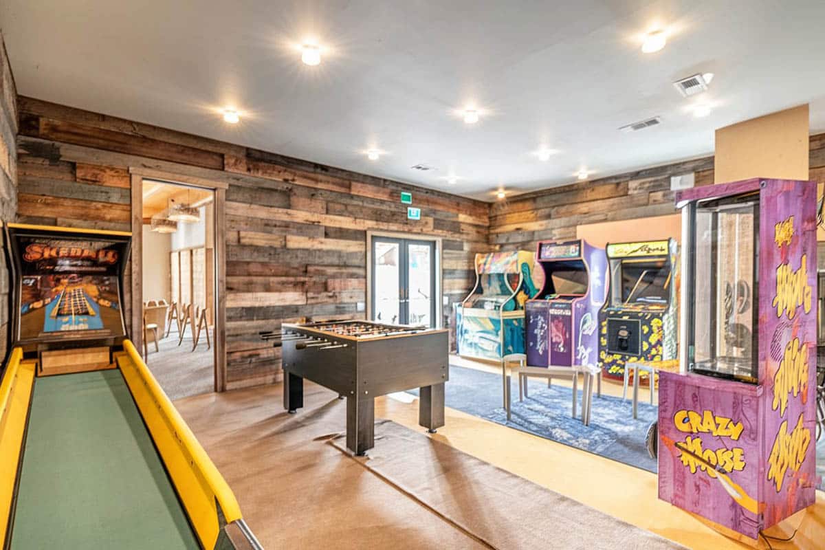 Arcade gaming with wood accent wall