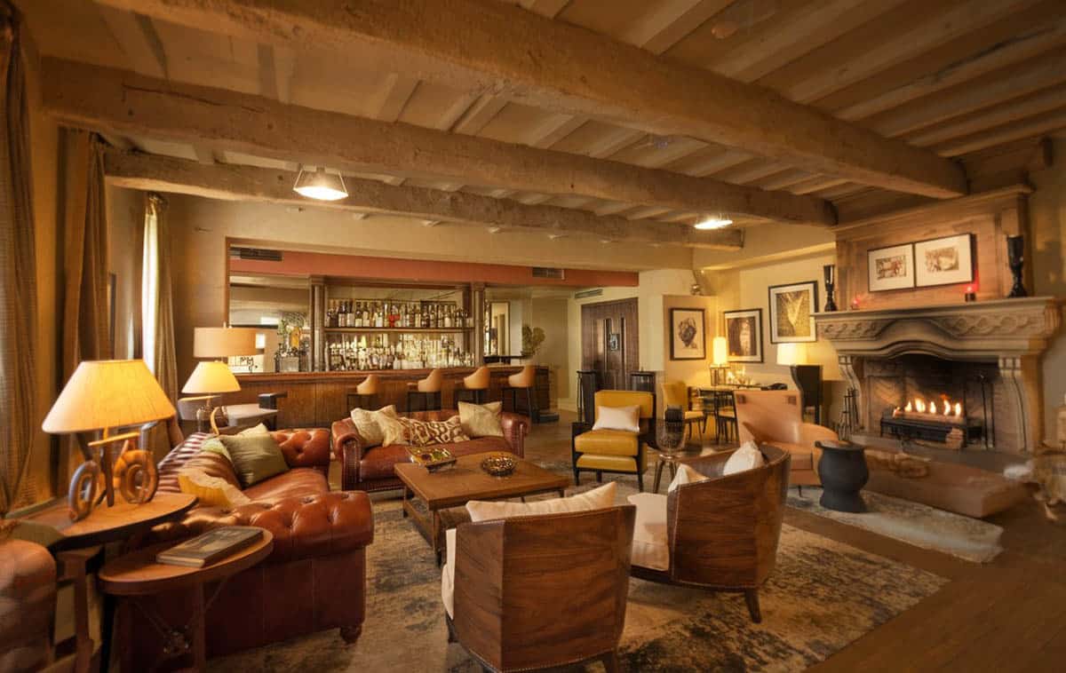 Cigar room with home bar and leather furniture