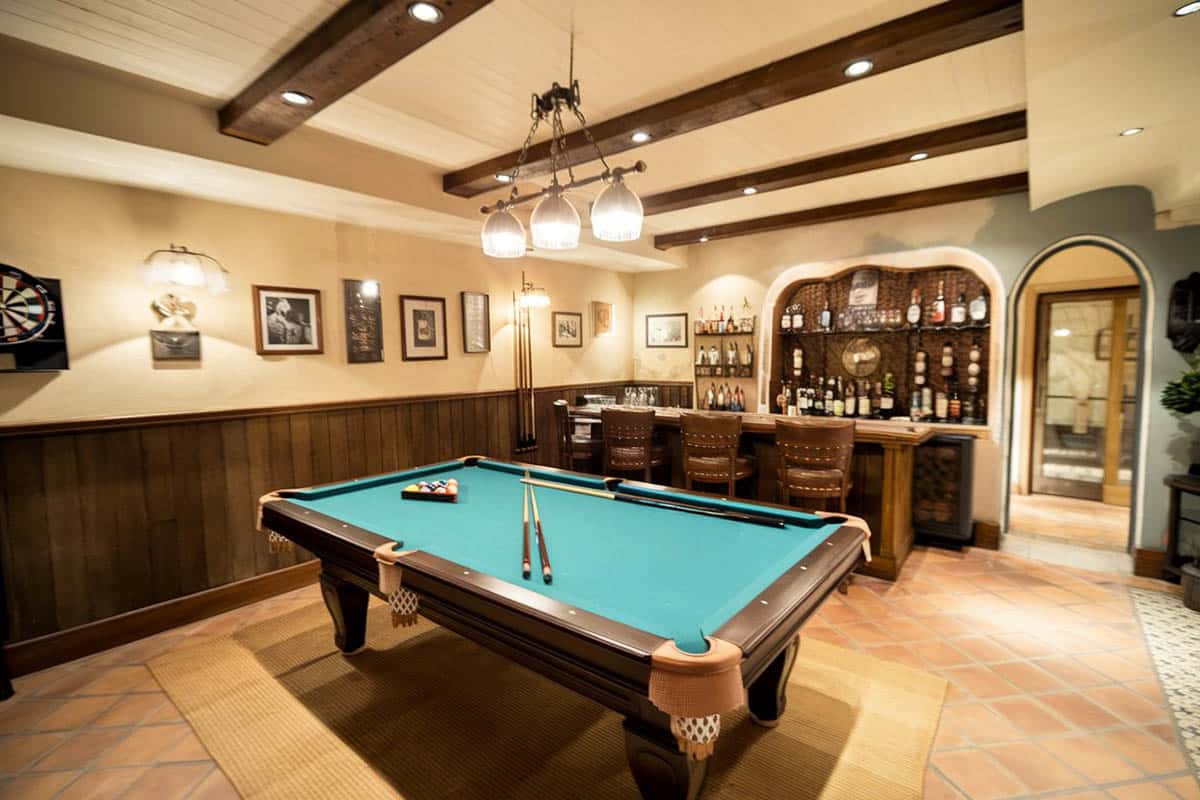 Room with large bar and billiards ball table