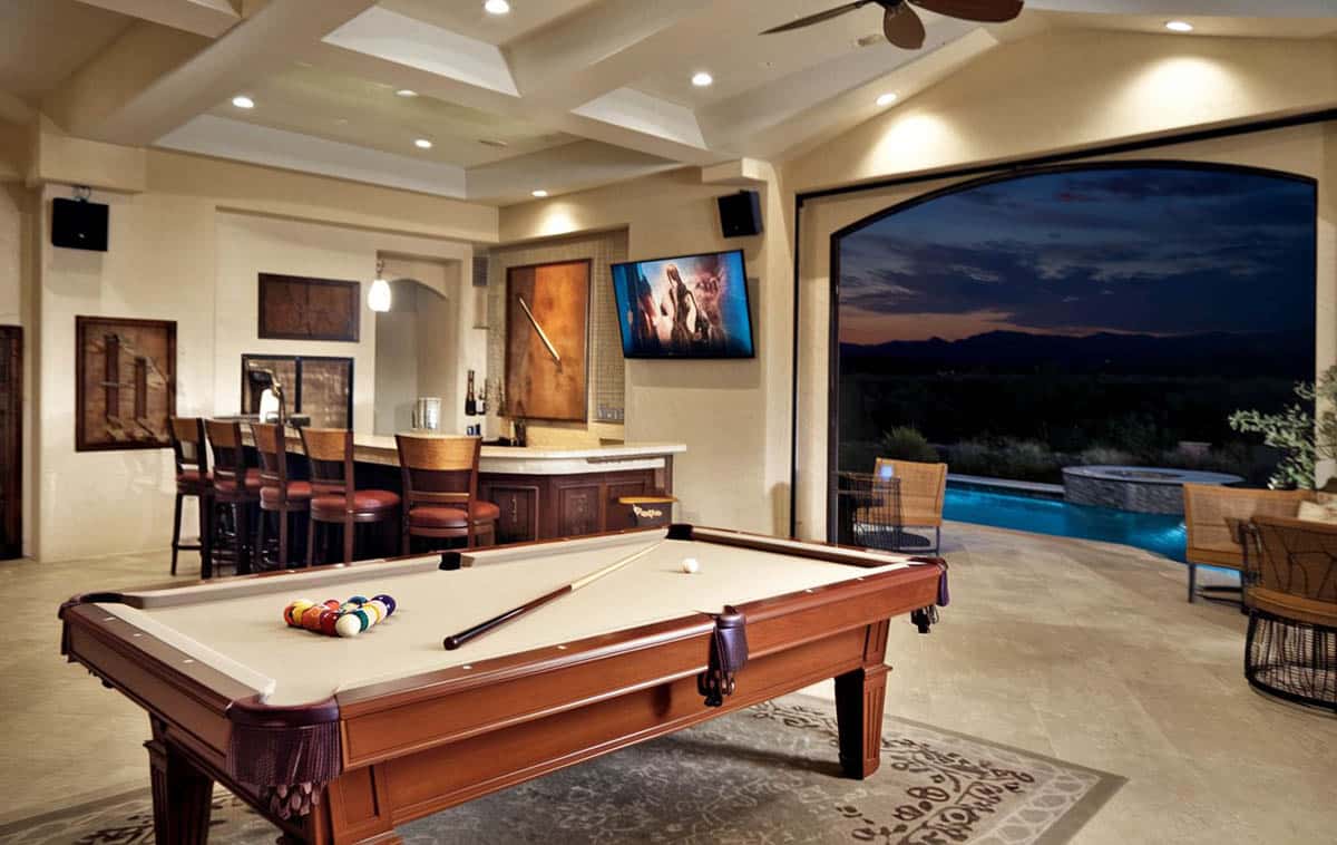 Open living area with views to backyard and swimming pool