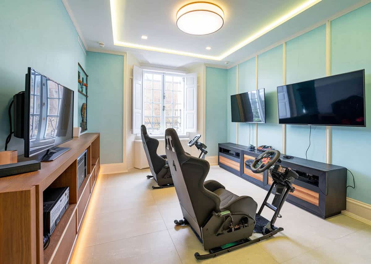 Room with nascar playseats and tv game monitors