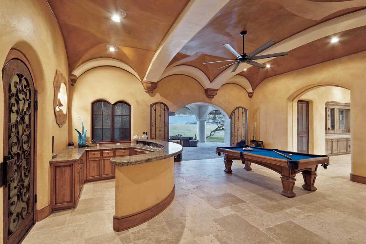 Large high ceiling game space with wrap around bar