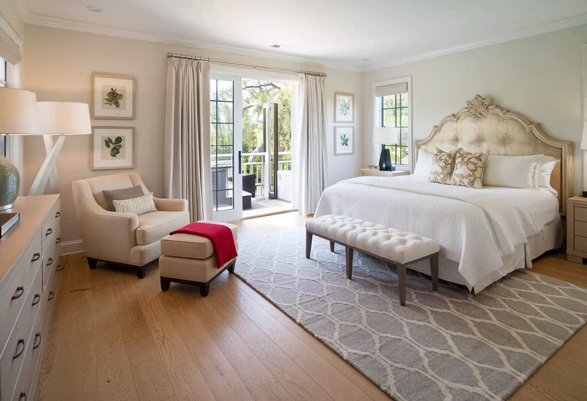 Bedroom with light hued hickory wide plank knotty flooring