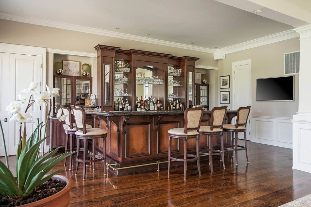 Bar with wooden teak floors set against cream walls
