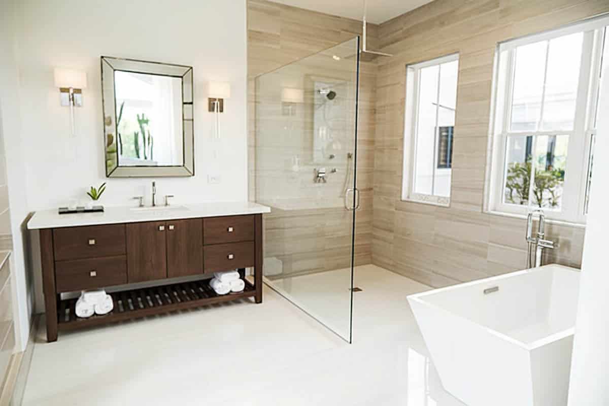 Bathroom with ceiling mounted rainfall shower head and freestanding Japanese tub