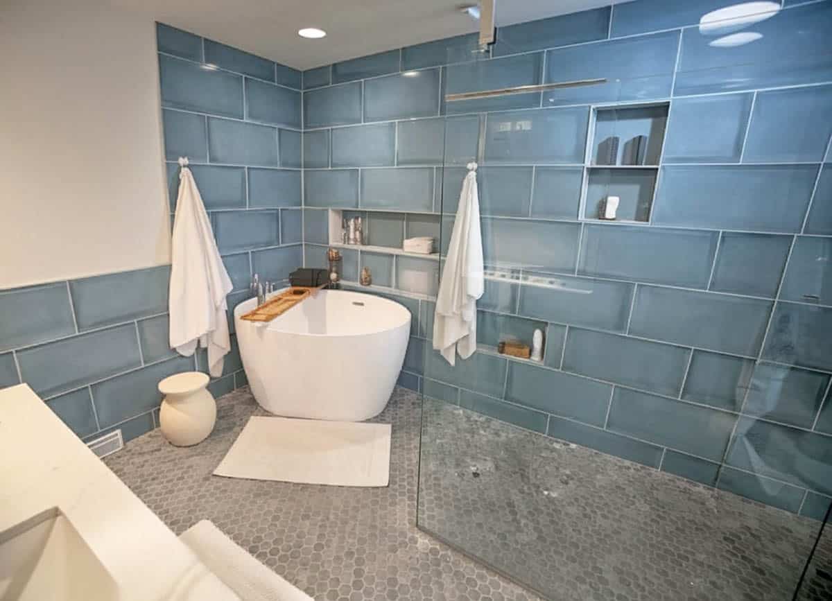 Japanese soaking tub in a glass walled shower