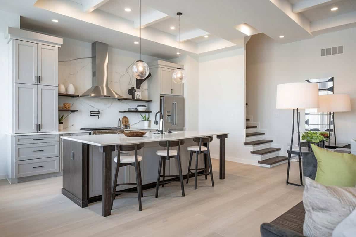 Rectangular island with decorative leg support and stools and round seats
