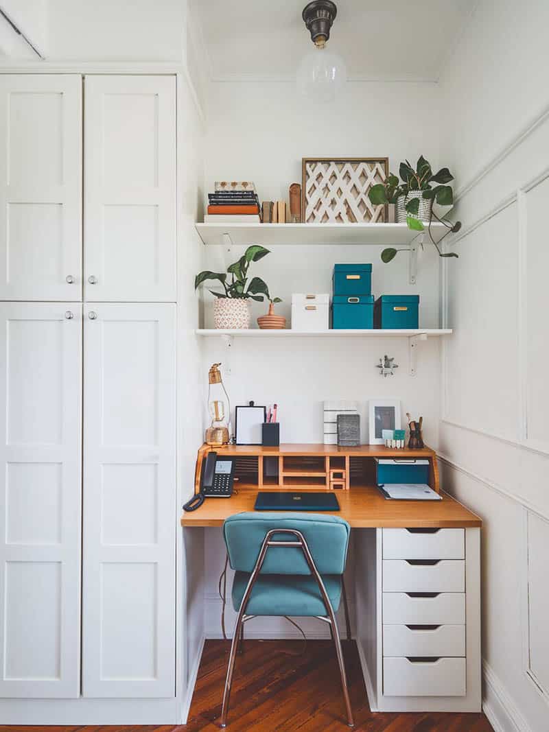 Kitchen pantry nook with small desk, chair and shelving
