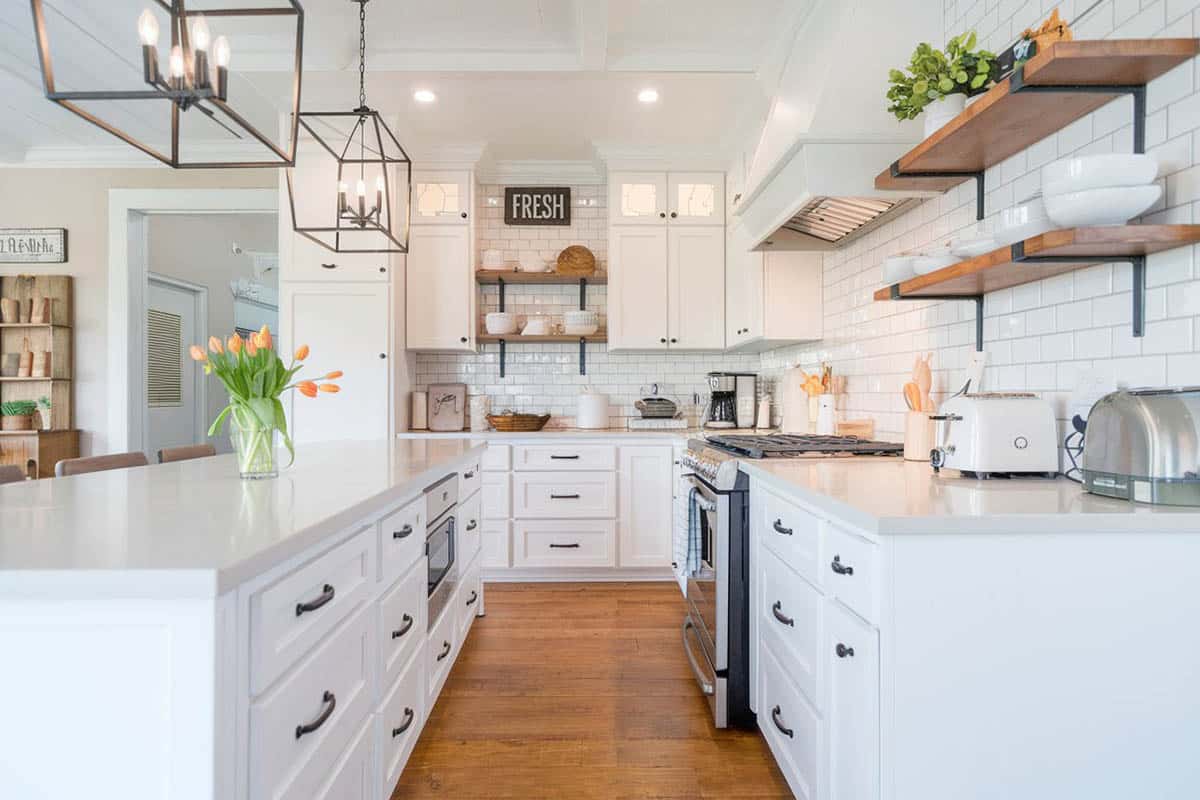 Kitchen with open shelving, white cabinets, white quartz countertops