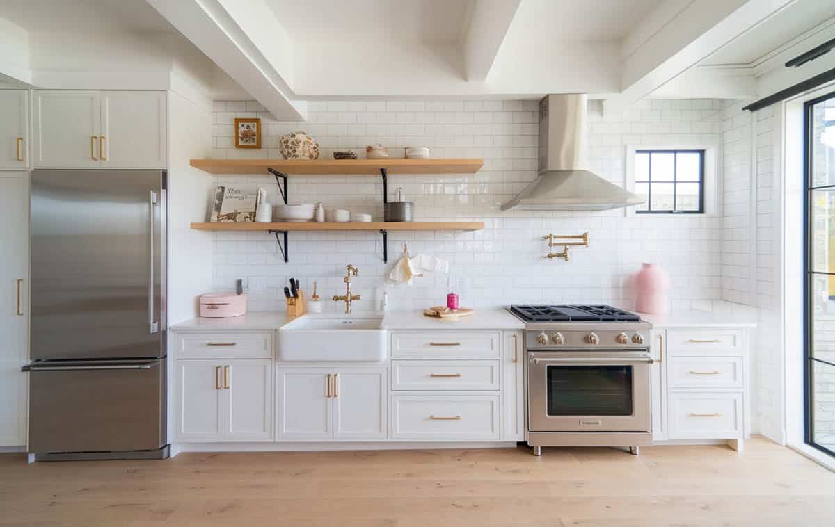 Single wall kitchen with cabinets, stainless steel appliances and window