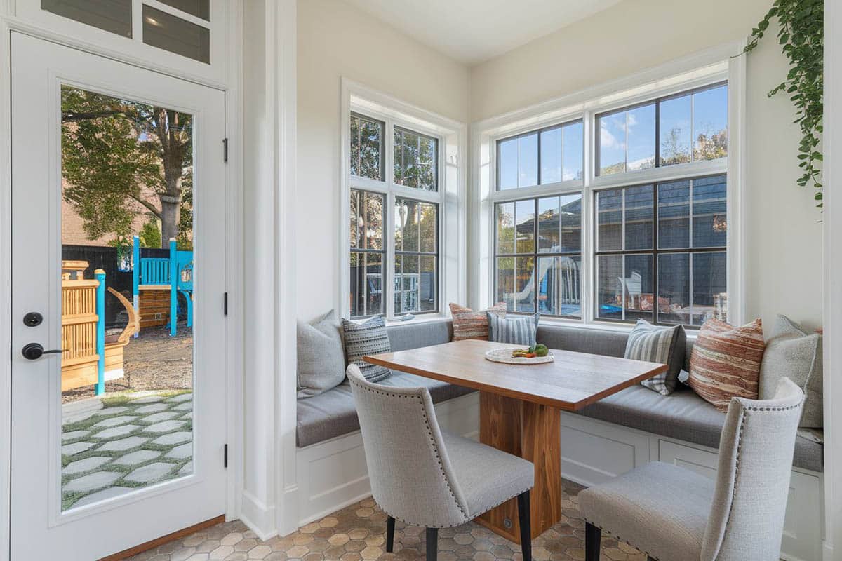Kitchen with built-in bench table nook and storage under the cushions