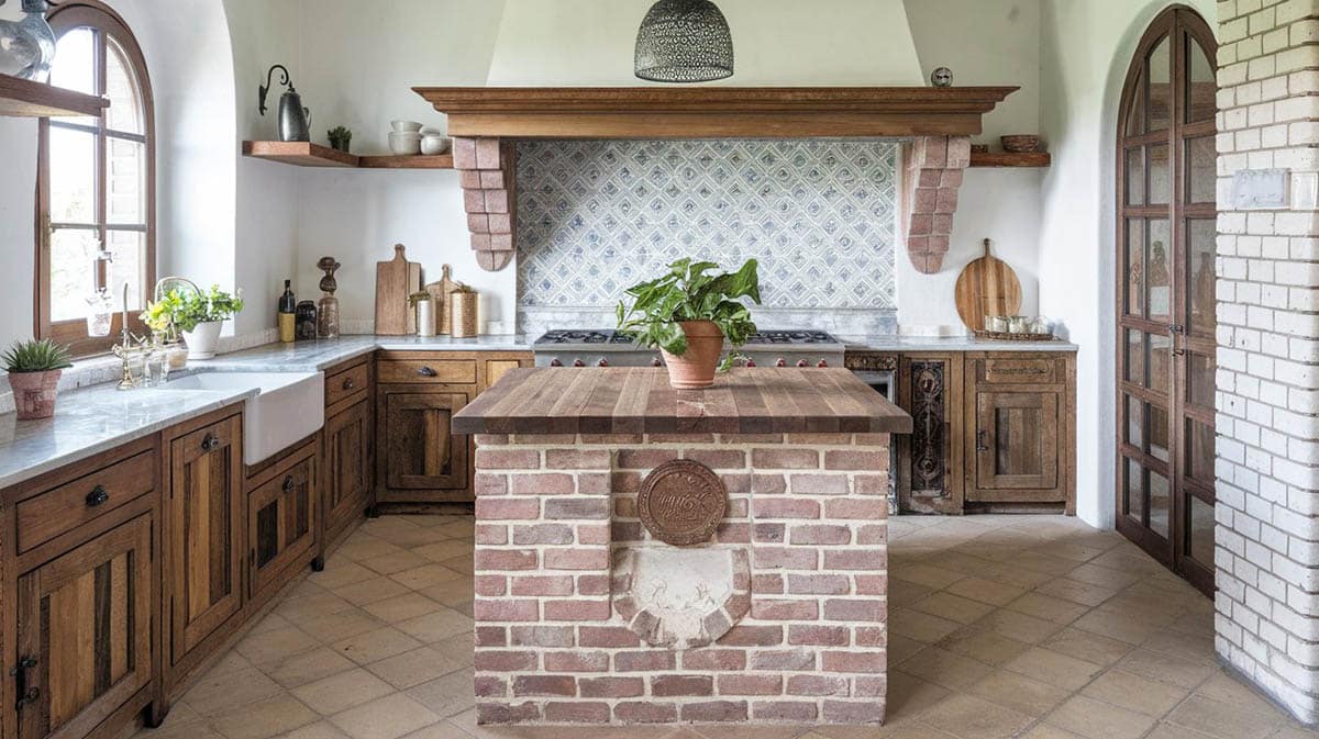 Rustic kitchen with brick island and wood counter